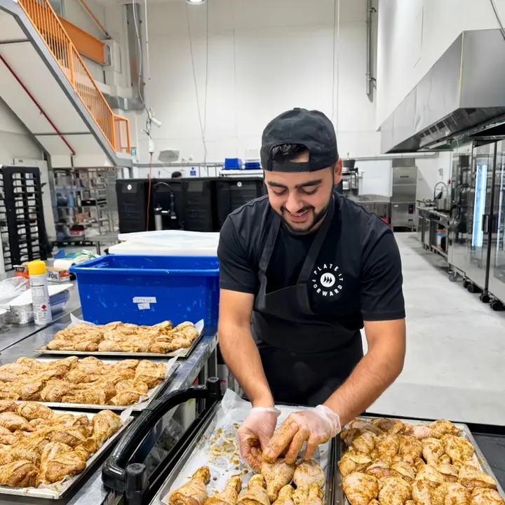 A chef portioning meals