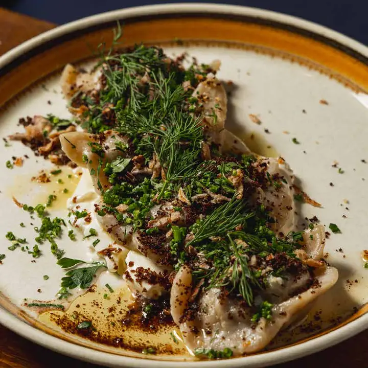 Potato varenyky with sour cream and dill