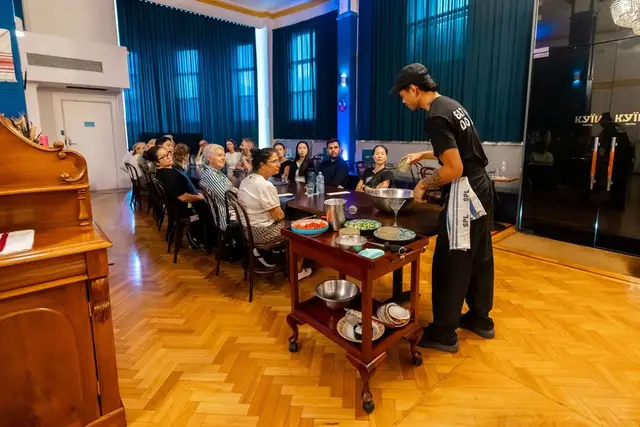 A team sharing lunch in the Kyiv Social ballroom
