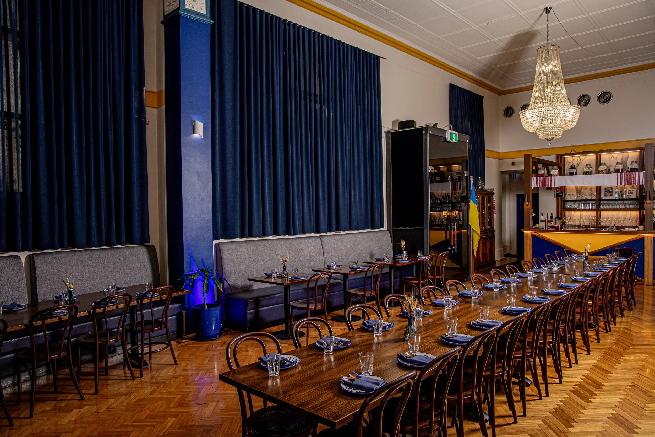 The Kyiv Social ballroom with its chandelier and long tables