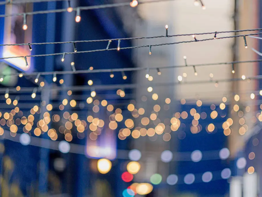 Festoon lights strung across the Kyiv Social laneway