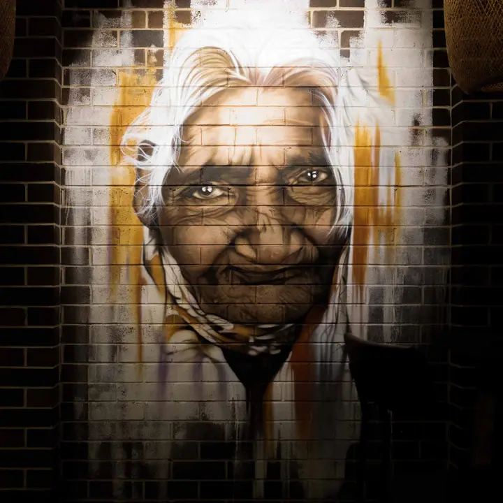 The Amma mural on the brick wall at Colombo Social